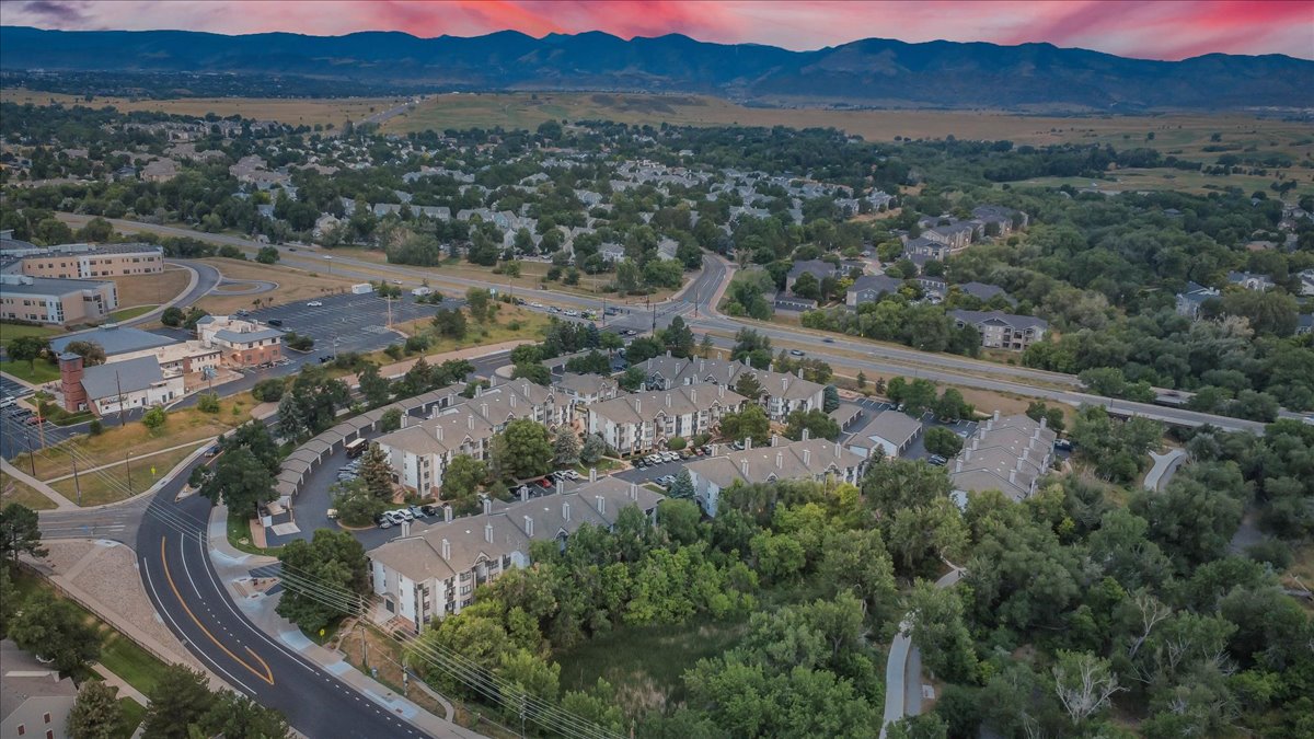 an aerial view of a residential neighborhood with mountains in the background at The Residences at Bear Creek