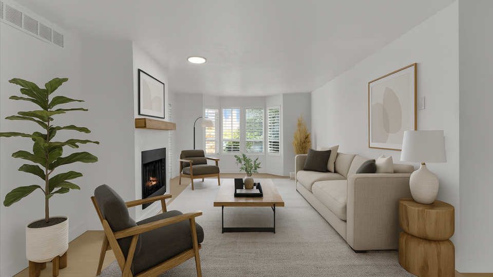 a rendering of a living room with a fireplace at The Residences at Bear Creek